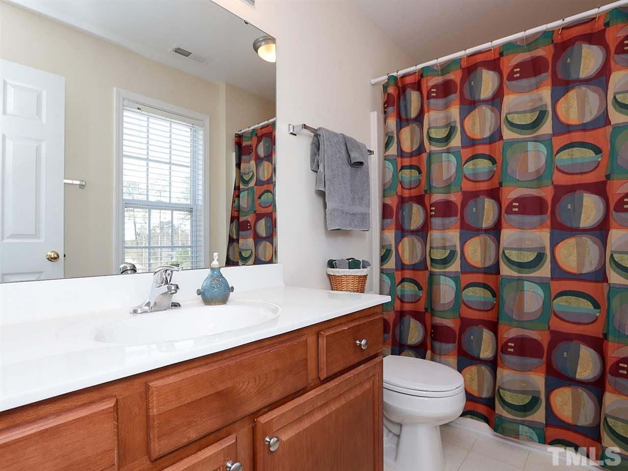 2708 Andover Glen Road Raleigh, NC 27604 - Photo 14 of 25 a bathroom with a sink toilet and shower