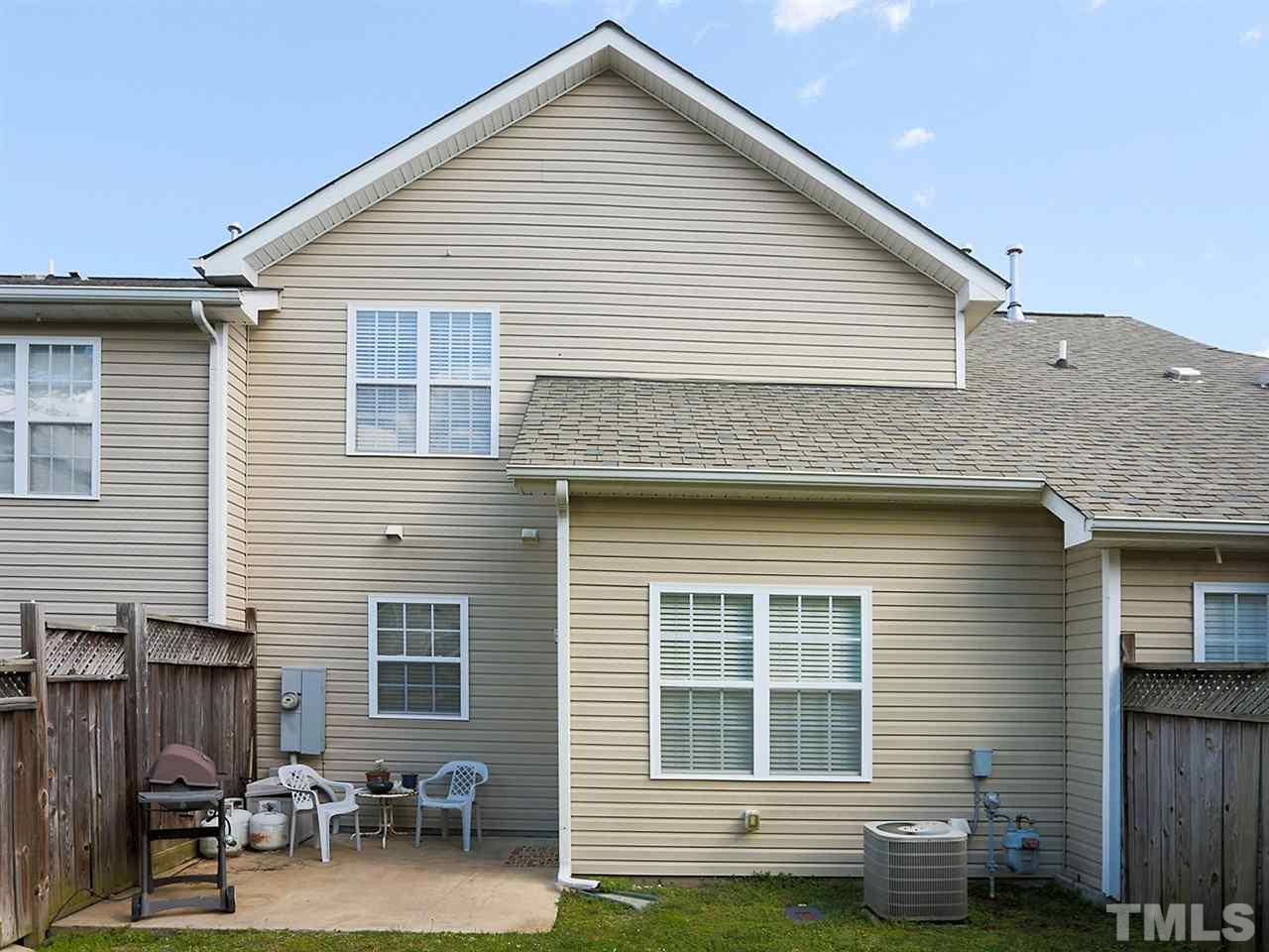 2708 Andover Glen Road Raleigh, NC 27604 - Photo 20 of 25 a view of backyard with a table and chairs and a barbeque