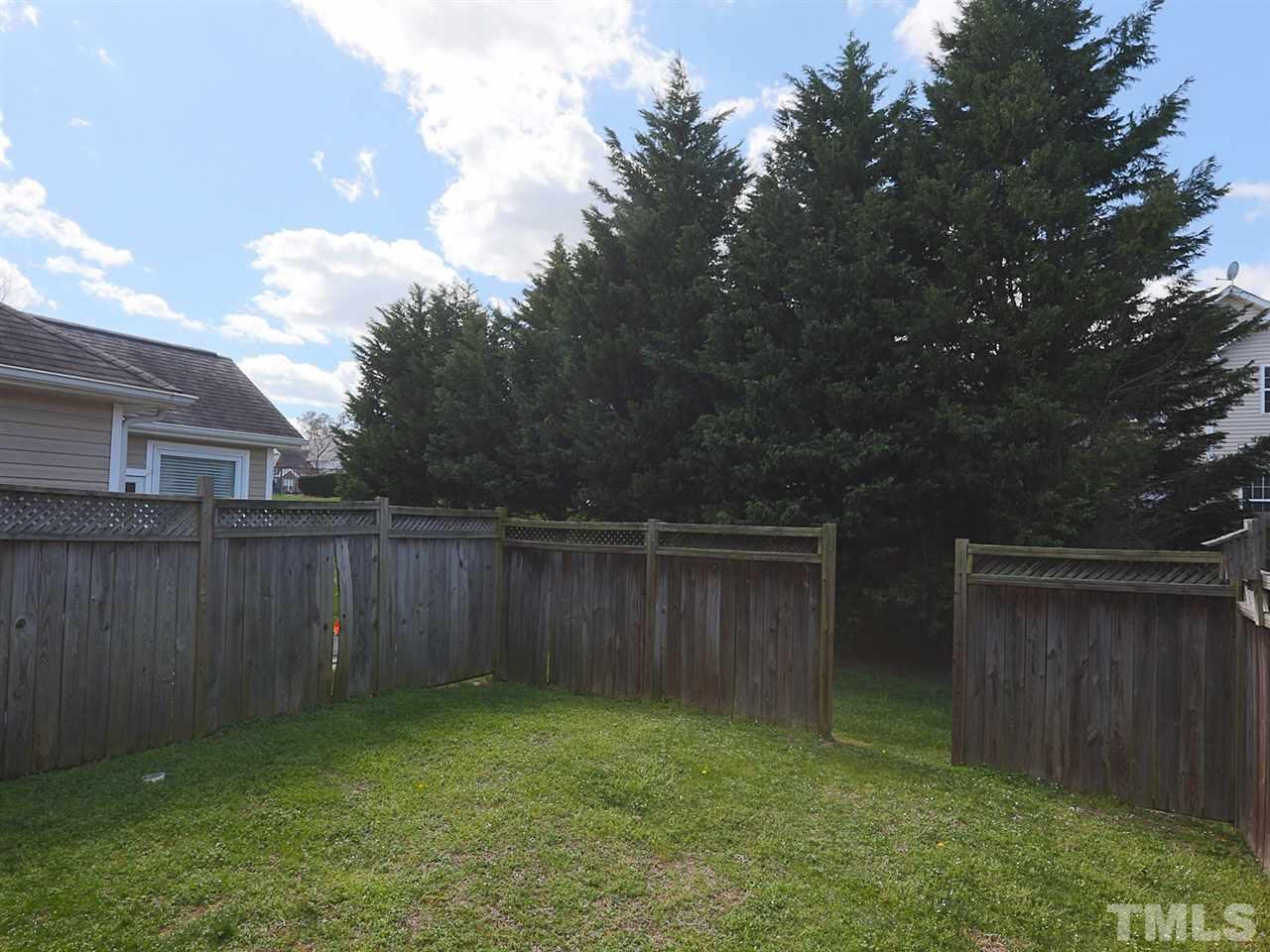 2708 Andover Glen Road Raleigh, NC 27604 - Photo 21 of 25 a backyard of a house with lots of green space