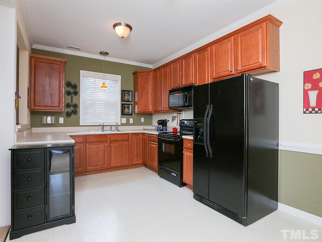 2708 Andover Glen Road Raleigh, NC 27604 - Photo 5 of 25 a kitchen with granite countertop stainless steel appliances a refrigerator and a sink