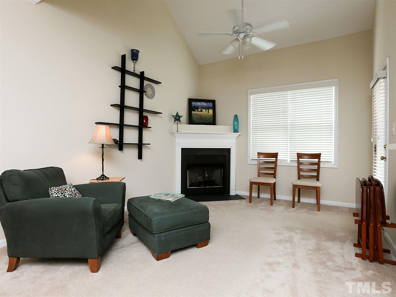 2708 Andover Glen Road Raleigh, NC 27604 - Photo 10 of 25 a living room with furniture and a fireplace