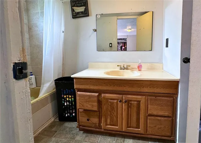 a bathroom with a sink and a mirror