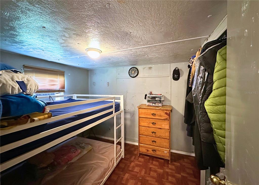 4816 Rustic Court East Lakeland, FL 33810 - Photo 15 of 16 a view of walk in closet with clothes and shoes