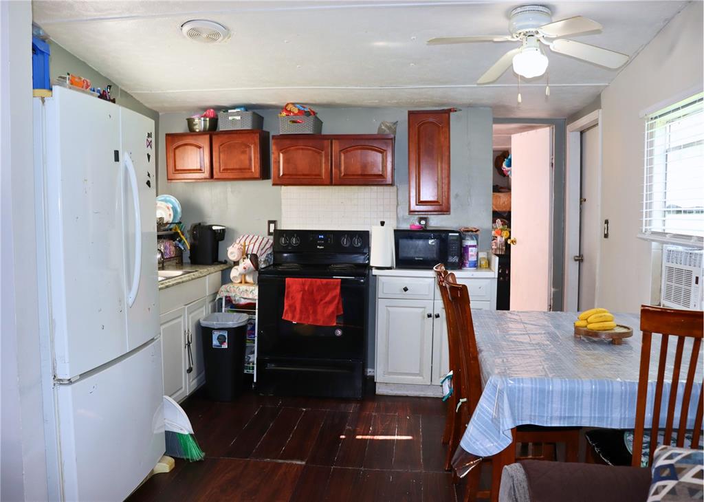 4816 Rustic Court East Lakeland, FL 33810 - Photo 4 of 16 a view of kitchen with cabinets and wooden floor