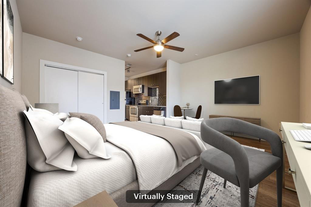 1900 Barton Springs Road, Unit 3013 Austin, TX 78704 - Photo 5 of 27 A clever layout offers combined bedroom and living space, plus a functional kitchen, perfect for compact urban living.