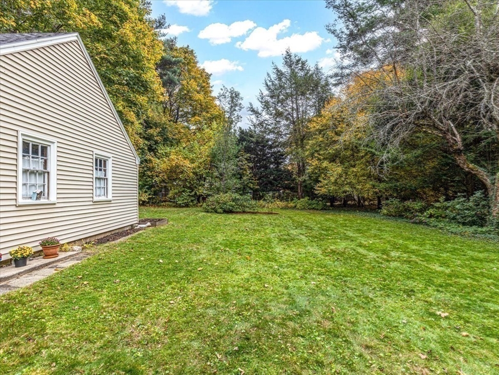 46 Park Street Dedham, MA 02026 - Photo 29 of 35 a view of a backyard with large trees
