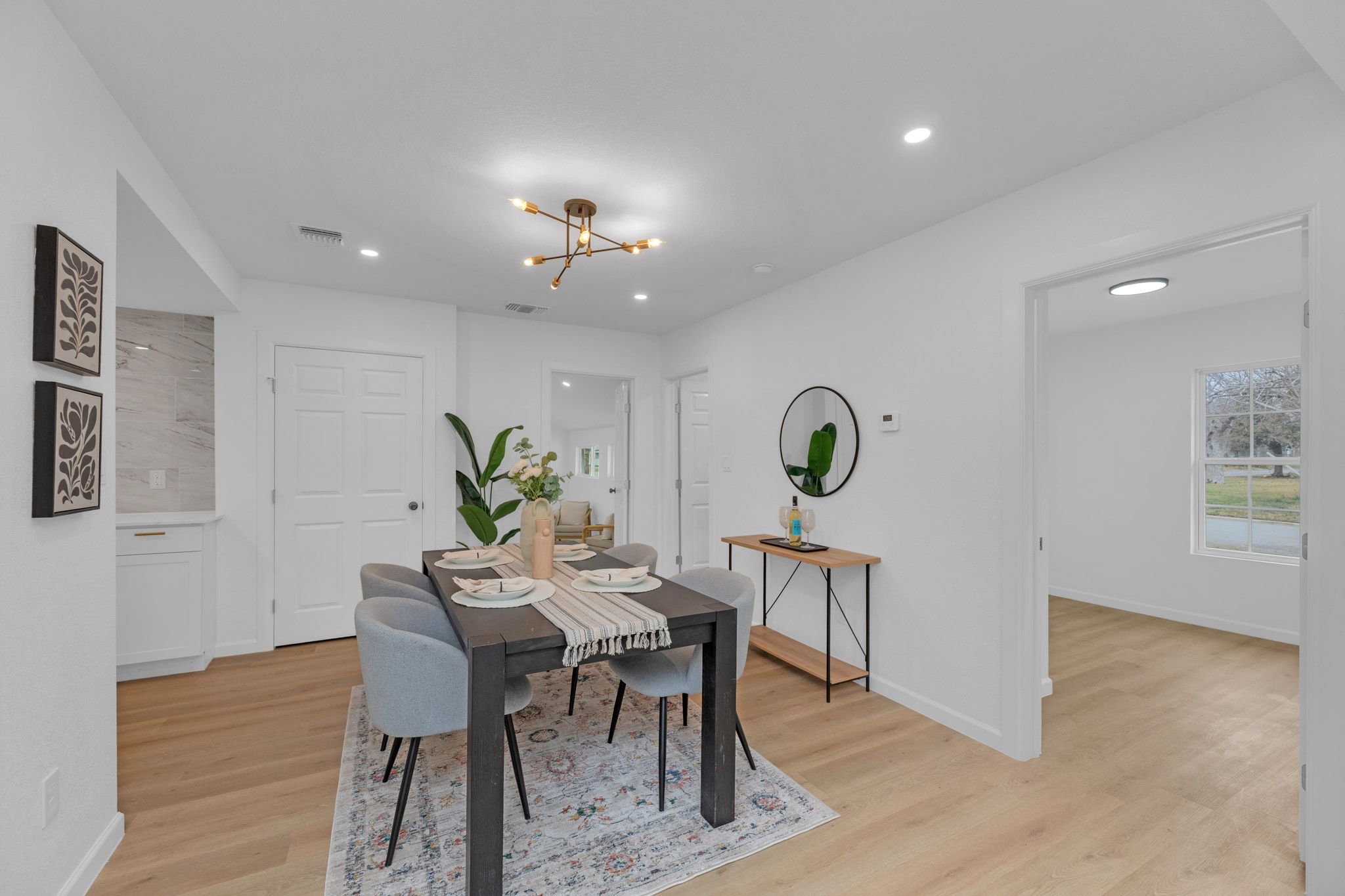 1709 Cecelia Street Taylor, TX 76574 - Photo 16 of 37 Dining room featuring light wood-style floors and suspended lighting