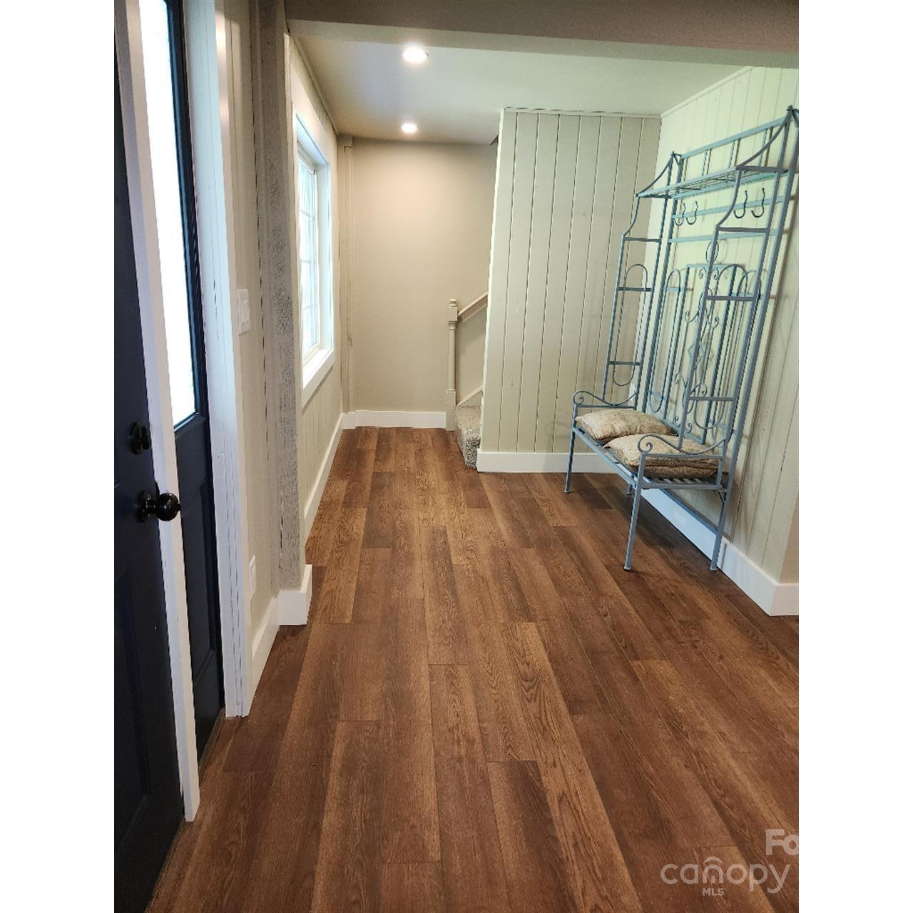 283 Robin Drive Marion, NC 28752 - Photo 16 of 30 a view of a hallway with wooden floor