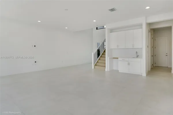 a utility room with a sink dryer and washer