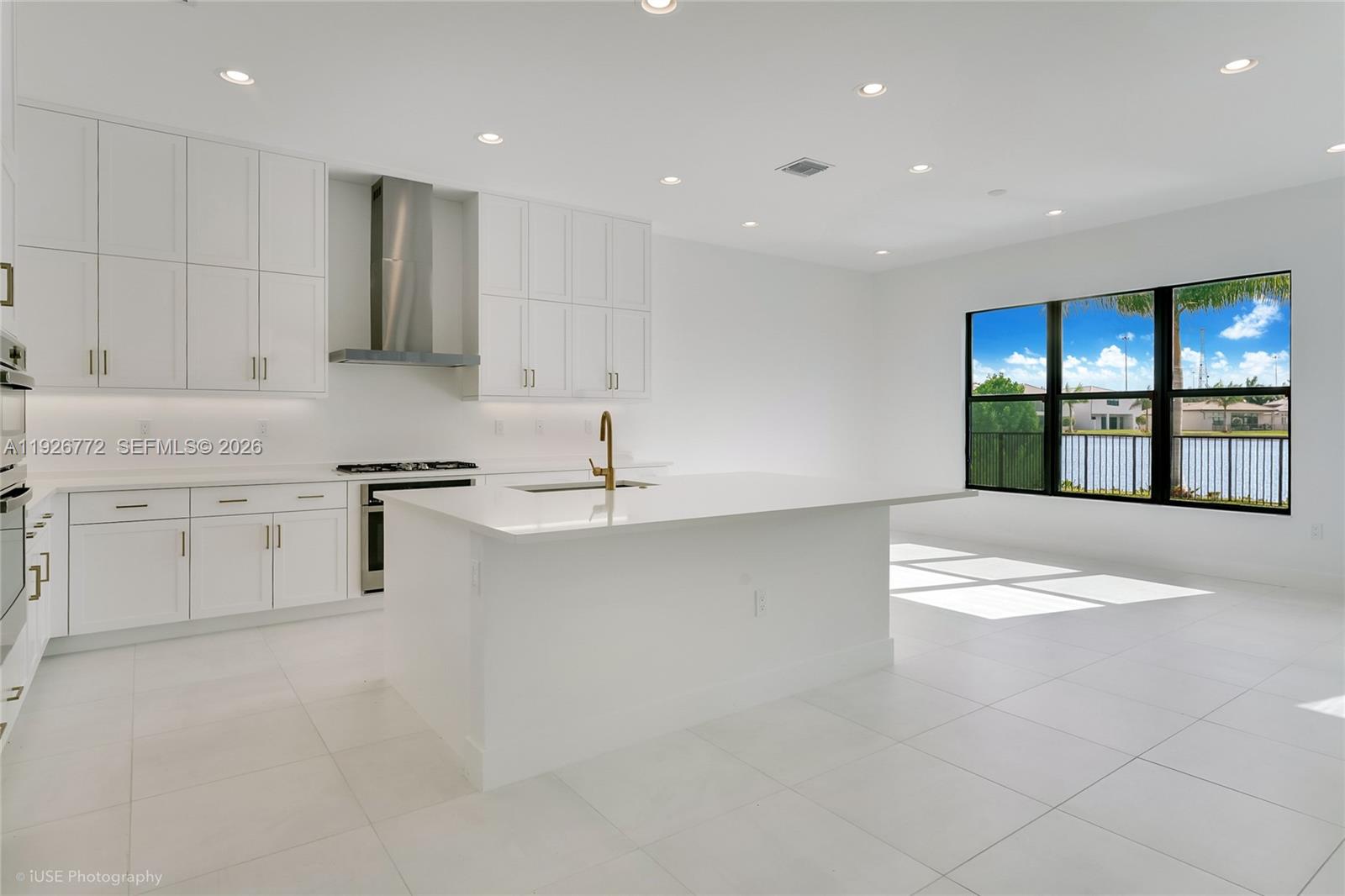 8095 Crystal Downs Avenue Boca Raton, FL 33434 - Photo 9 of 27 a view of kitchen with stainless steel appliances refrigerator oven and cabinets