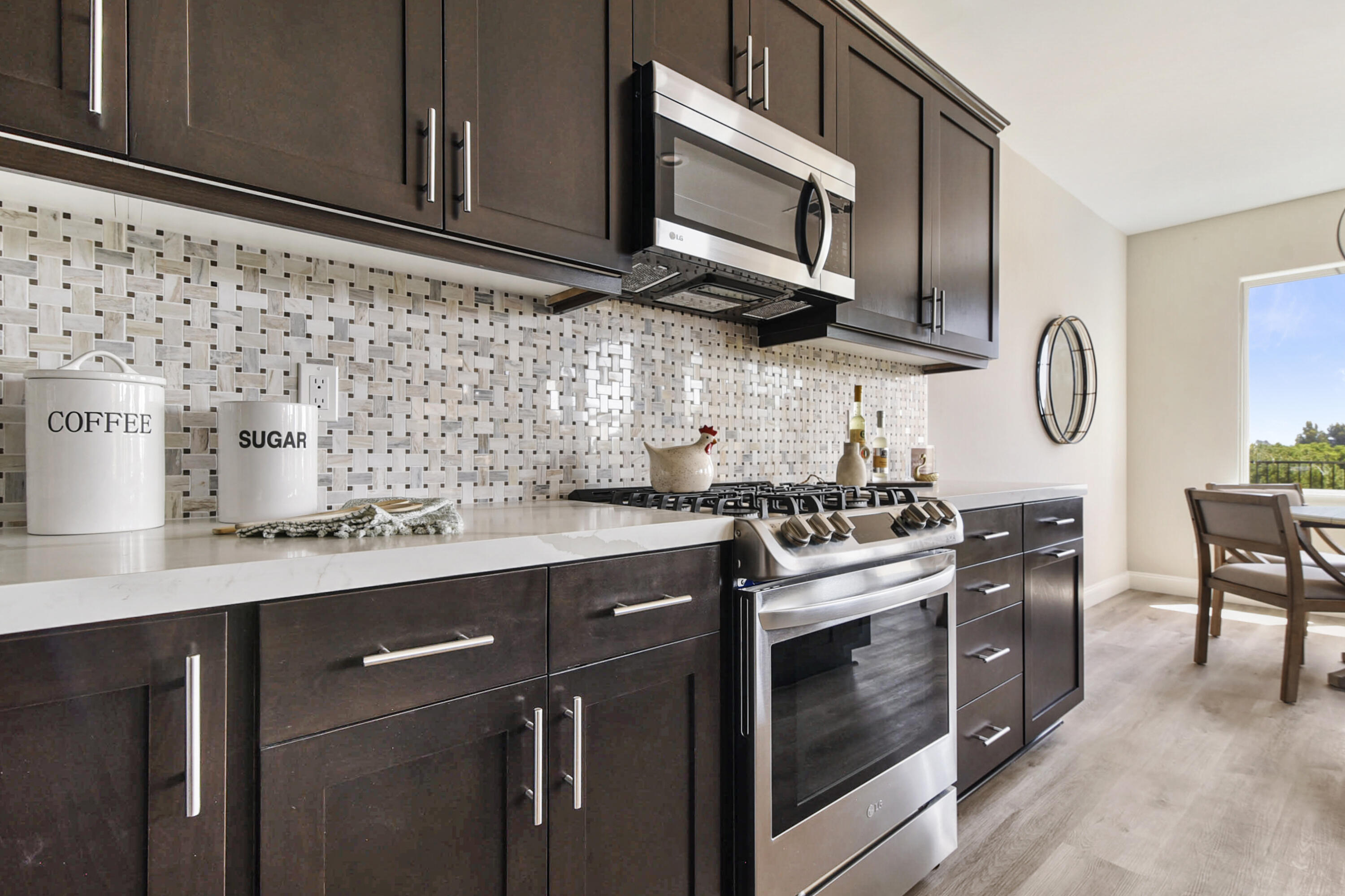 280 Oak Hill Drive Lompoc, CA 93436 - Photo 15 of 31 a kitchen with stainless steel appliances granite countertop a sink stove and microwave