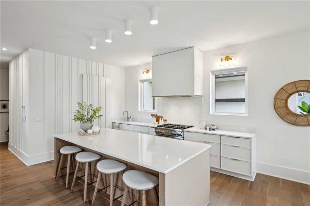 407 Linden Avenue Northeast, Unit A Atlanta, GA 30308 - Photo 11 of 65 a kitchen with a sink cabinets and wooden floor