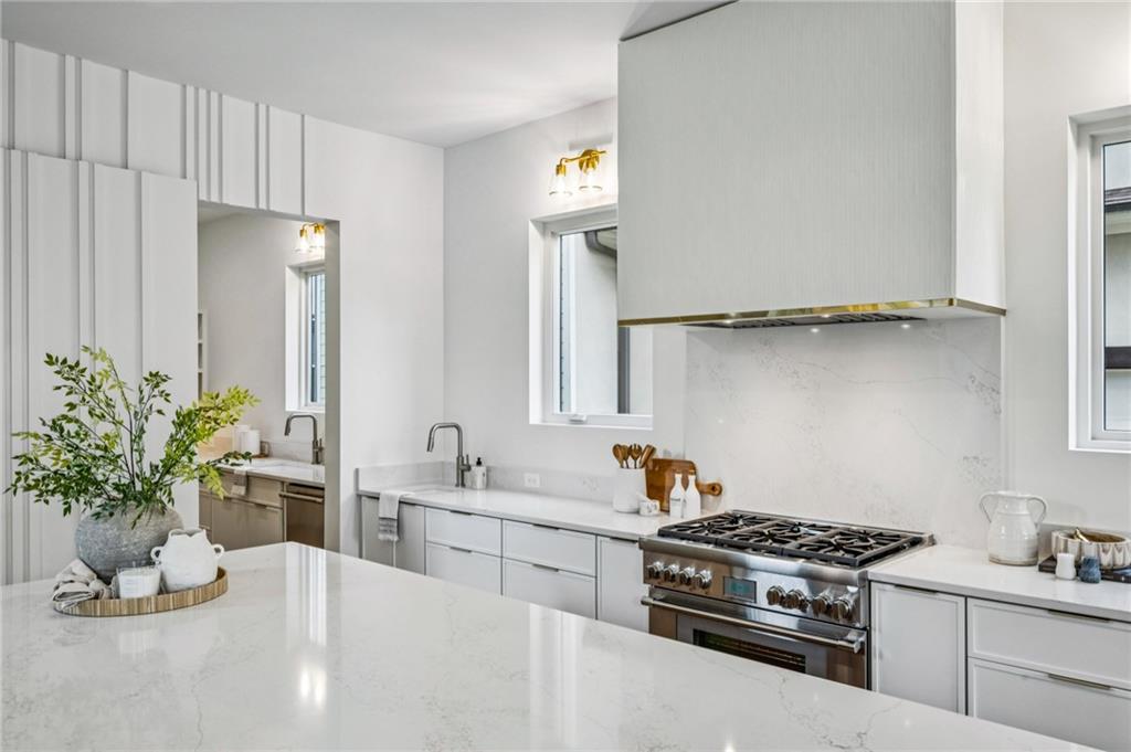 407 Linden Avenue Northeast, Unit A Atlanta, GA 30308 - Photo 14 of 65 a kitchen with a stove and cabinets