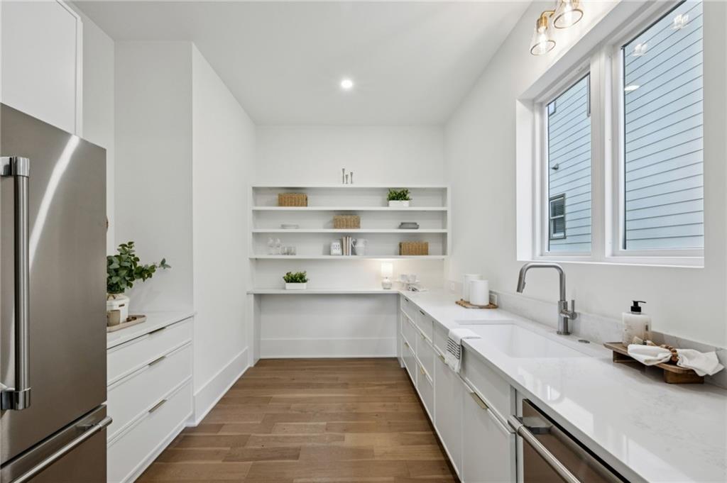 407 Linden Avenue Northeast, Unit A Atlanta, GA 30308 - Photo 16 of 65 a kitchen with a sink and white cabinets