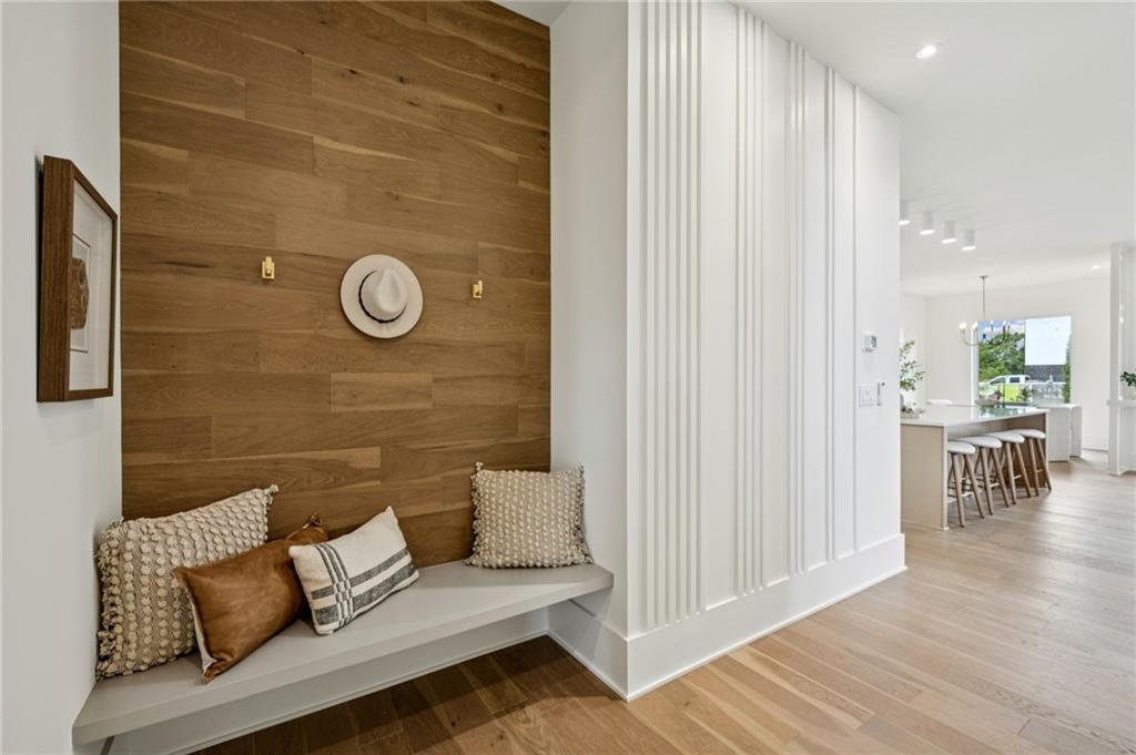 407 Linden Avenue Northeast, Unit A Atlanta, GA 30308 - Photo 19 of 65 a view of a wooden floor and chair in living room