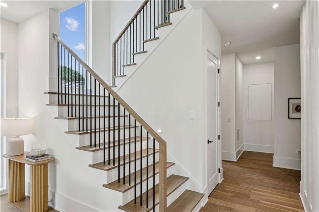 407 Linden Avenue Northeast, Unit A Atlanta, GA 30308 - Photo 22 of 65 a view of a hallway with wooden floor and entryway