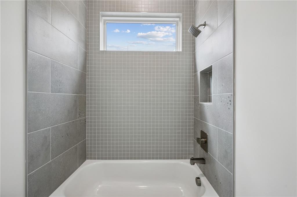 407 Linden Avenue Northeast, Unit A Atlanta, GA 30308 - Photo 36 of 65 a bathroom with a bathtub