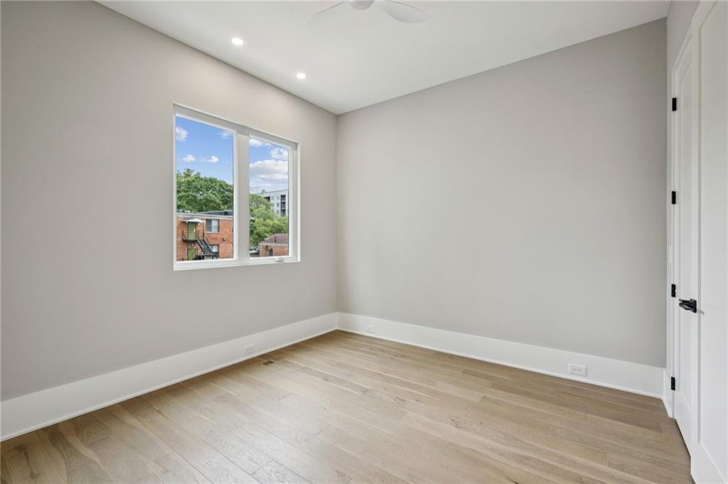 407 Linden Avenue Northeast, Unit A Atlanta, GA 30308 - Photo 37 of 65 wooden floor in an empty room