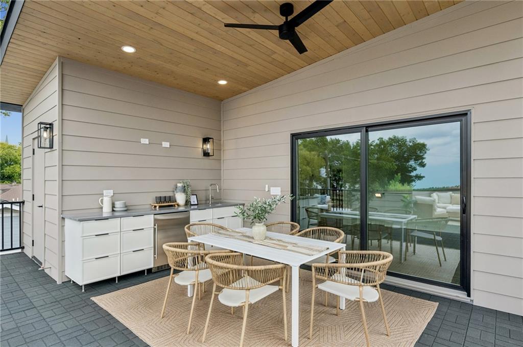 407 Linden Avenue Northeast, Unit A Atlanta, GA 30308 - Photo 42 of 65 a dining room with furniture and window