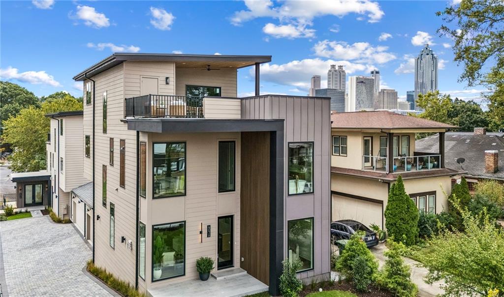 407 Linden Avenue Northeast, Unit A Atlanta, GA 30308 - Photo 47 of 65 a front view of a house with yard and trees