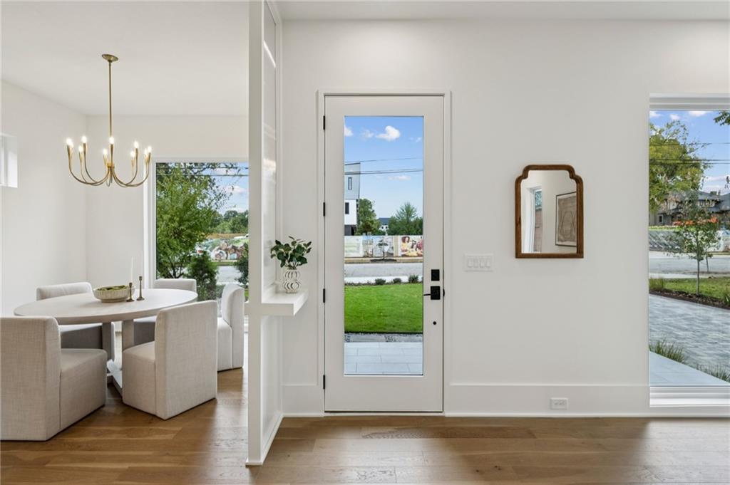 407 Linden Avenue Northeast, Unit A Atlanta, GA 30308 - Photo 5 of 65 a view of a dining room with furniture window and wooden floor