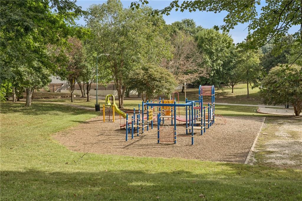 407 Linden Avenue Northeast, Unit A Atlanta, GA 30308 - Photo 55 of 65 a view of a park with swings