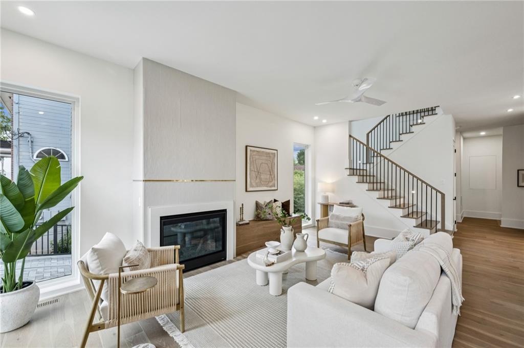 407 Linden Avenue Northeast, Unit A Atlanta, GA 30308 - Photo 6 of 65 a living room with furniture a fireplace and a potted plant