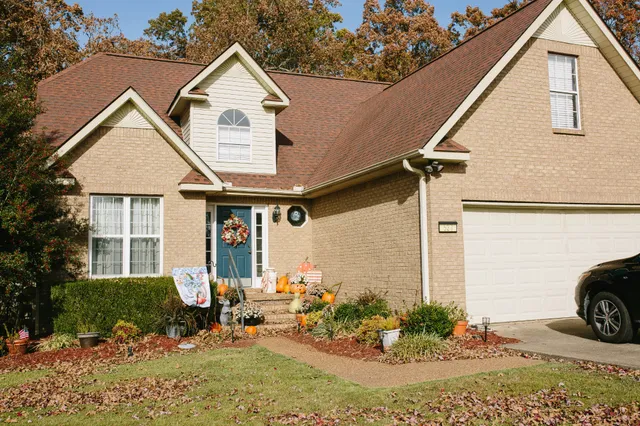 a front view of a house with garden