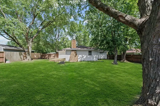 a view of a backyard with a small cabin