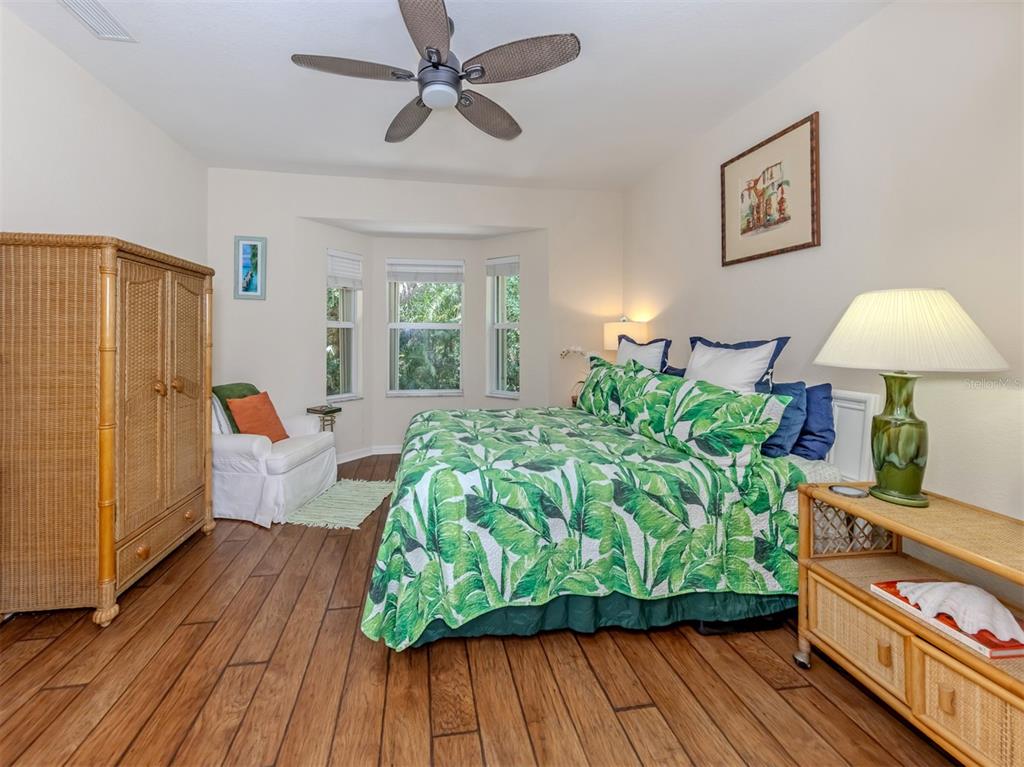 205 Reclinata Circle Venice, FL 34292 - Photo 25 of 62 a living room with furniture and a wooden floor