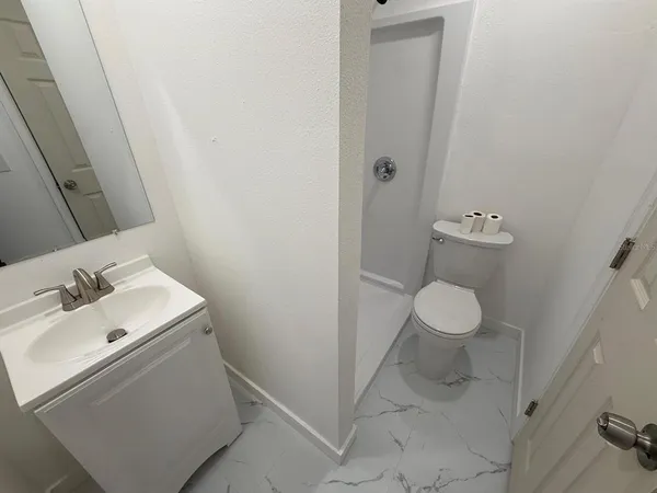 a bathroom with a sink and a toilet
