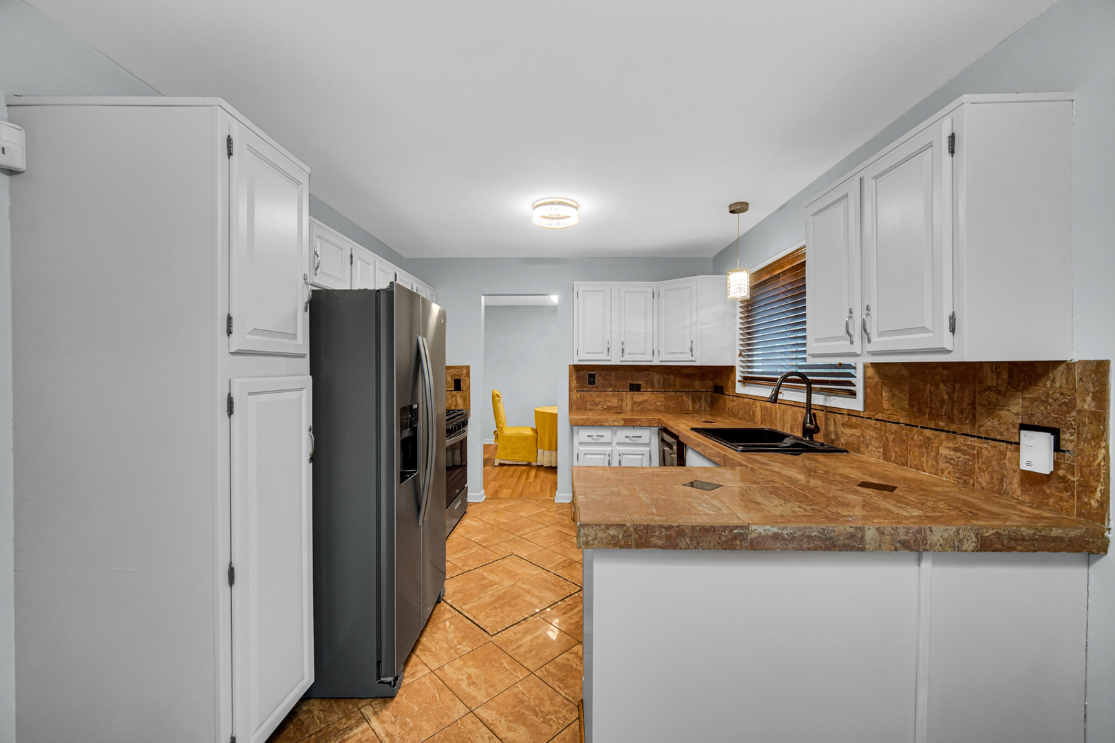 40 Huntingwood Road Matteson, IL 60443 - Photo 13 of 27 a kitchen with stainless steel appliances granite countertop a refrigerator a stove and a sink
