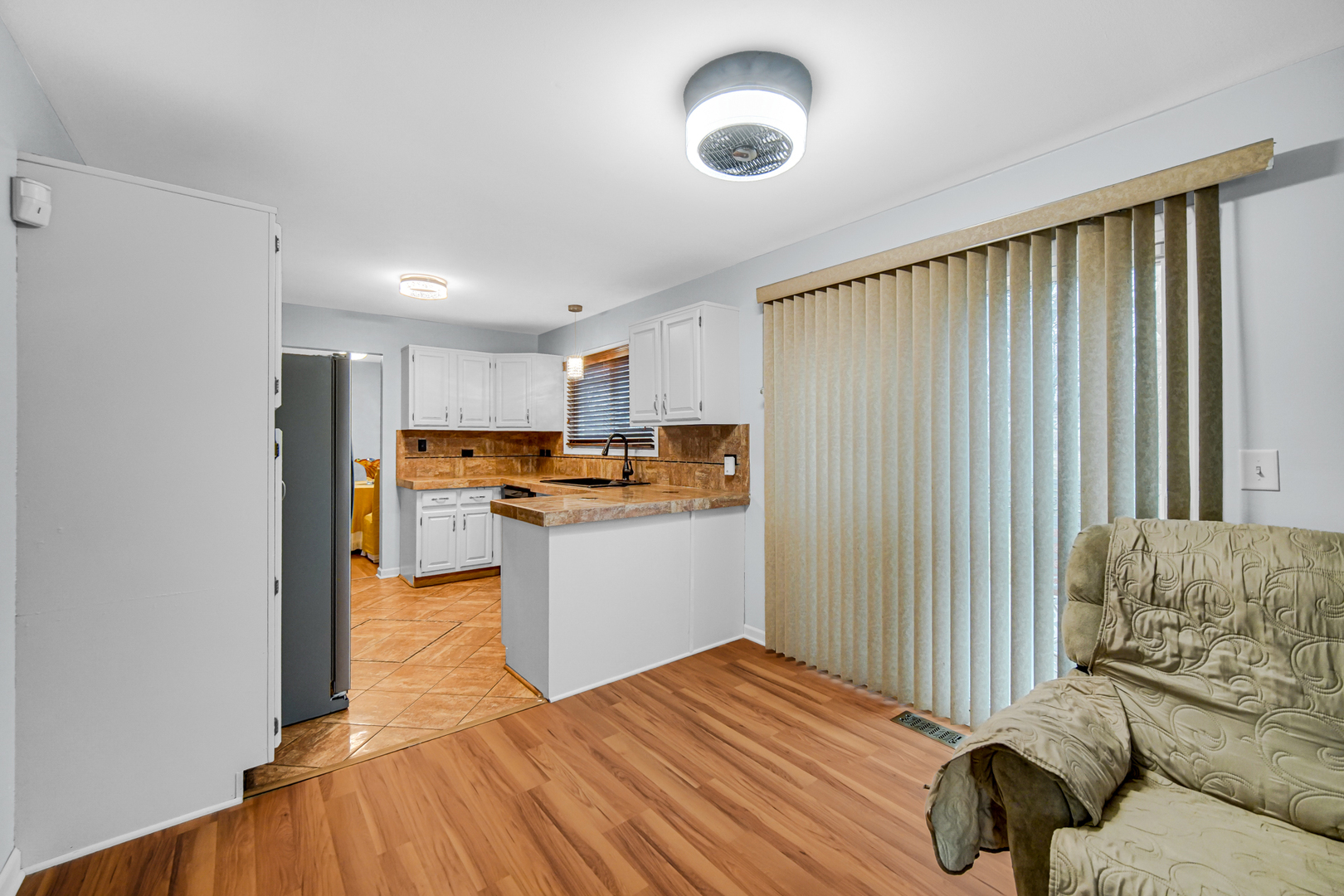 40 Huntingwood Road Matteson, IL 60443 - Photo 14 of 27 a kitchen with a refrigerator and white cabinets