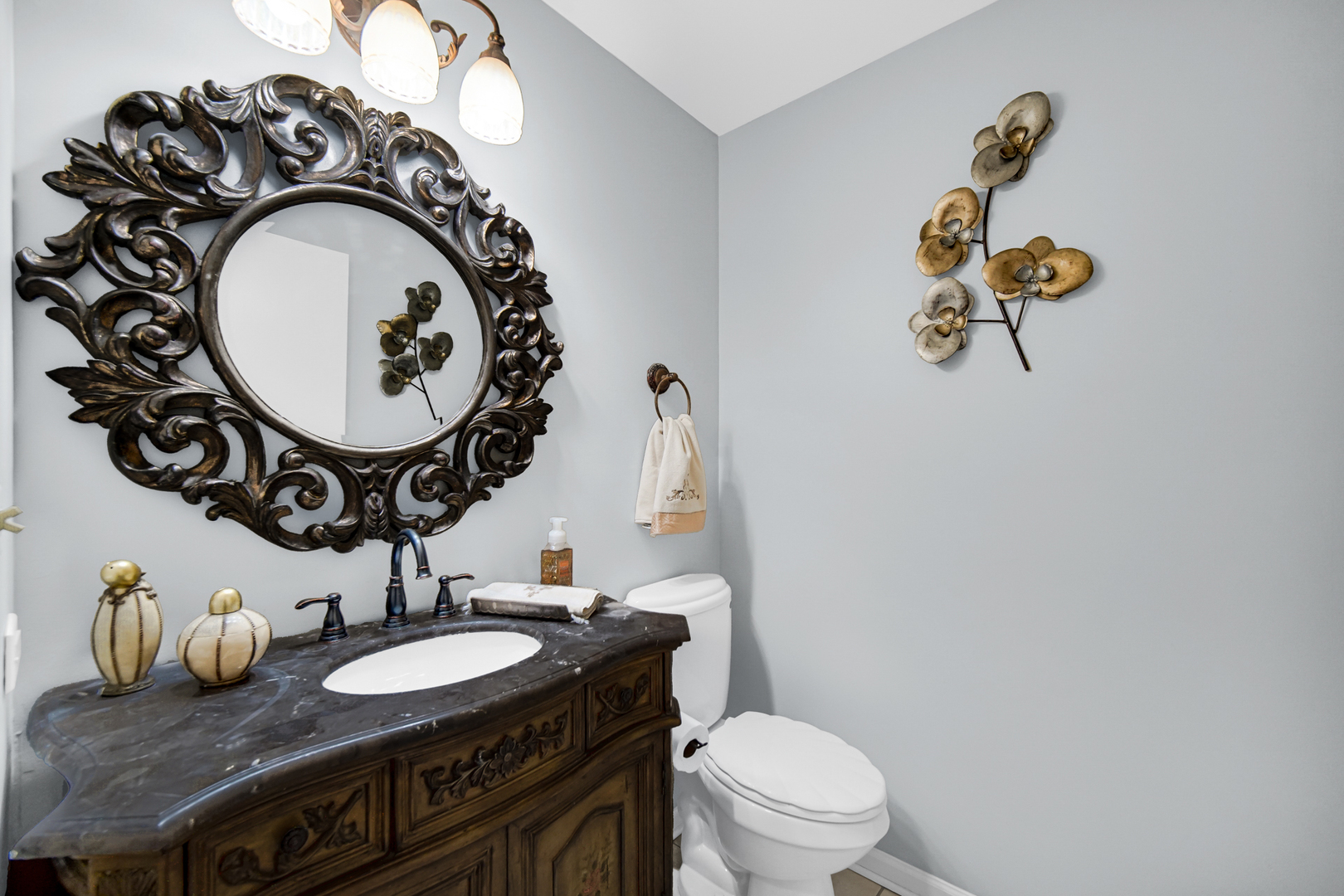 40 Huntingwood Road Matteson, IL 60443 - Photo 21 of 27 a bathroom with a granite countertop toilet sink and mirror