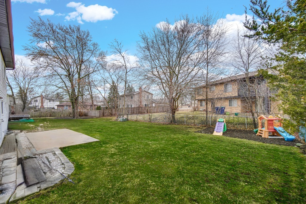 40 Huntingwood Road Matteson, IL 60443 - Photo 27 of 27 a view of a backyard with table and chairs and a fire pit