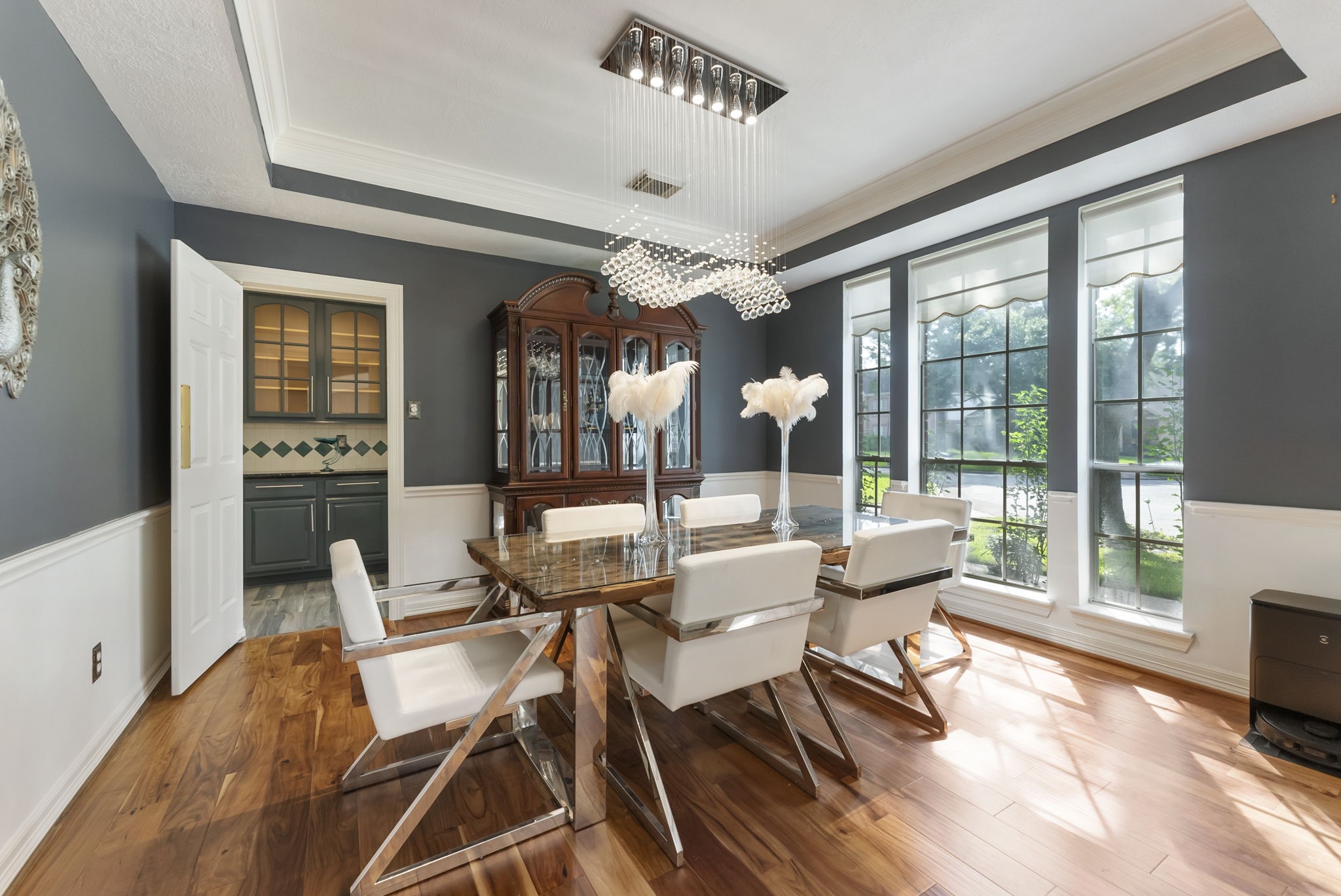 12907 Ryaneagles Circle Houston, TX 77044 - Photo 6 of 48 a dining room with furniture a chandelier and wooden floor