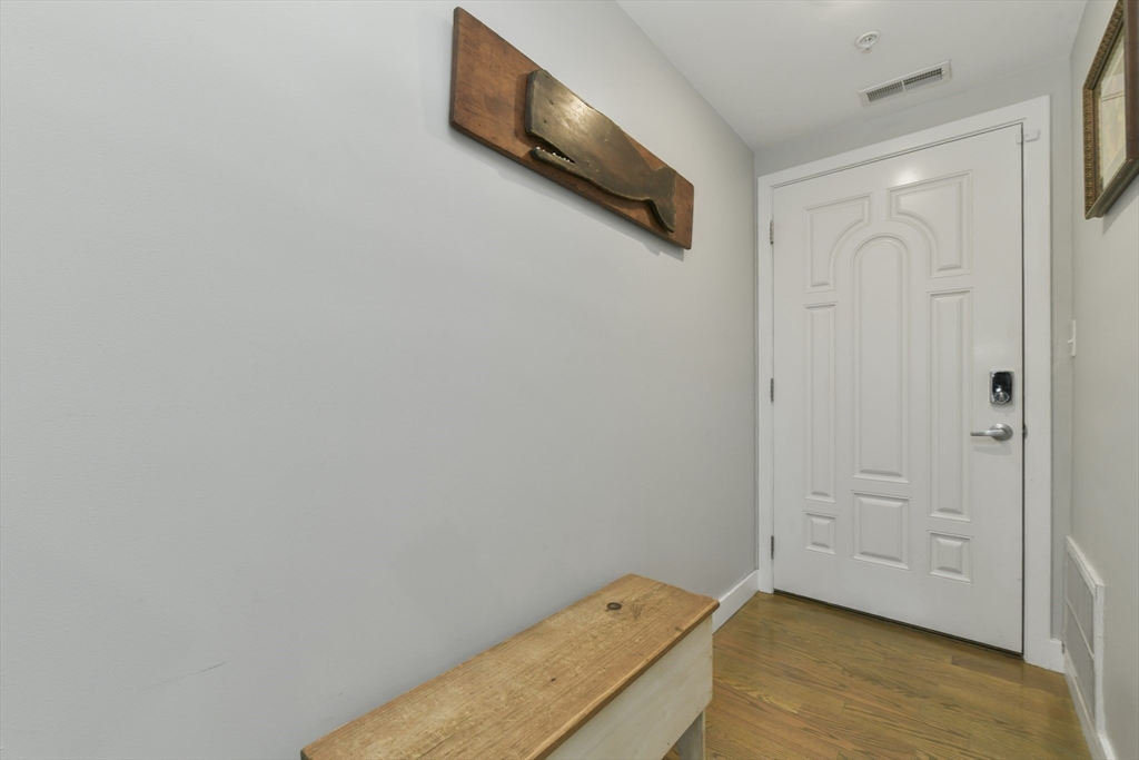 47 Sargent Street, Unit 3 Boston, MA 02125 - Photo 16 of 21 a view of a room with wooden floor and cabinet