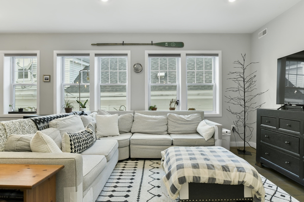 47 Sargent Street, Unit 3 Boston, MA 02125 - Photo 2 of 21 a bedroom with furniture and windows