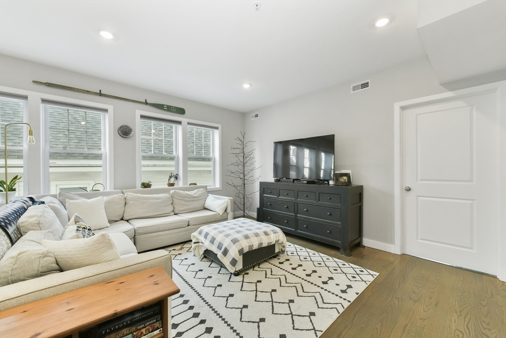 47 Sargent Street, Unit 3 Boston, MA 02125 - Photo 3 of 21 a living room with furniture and a window