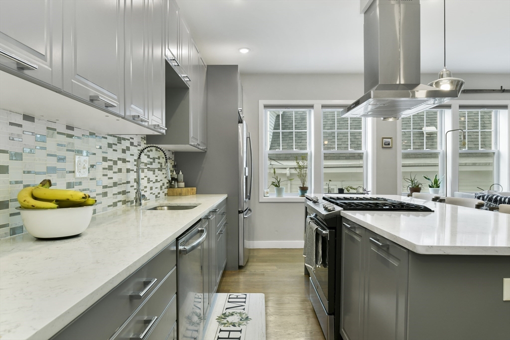 47 Sargent Street, Unit 3 Boston, MA 02125 - Photo 7 of 21 a kitchen with a sink and stove