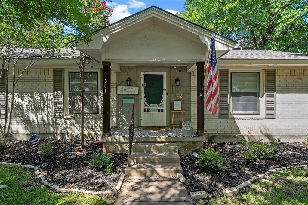 301 North 40th Street Waco, TX 76710 - Photo 3 of 26 Brick exterior with a covered front porch featuring two dark wood columns