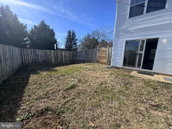 a view of a backyard of the house