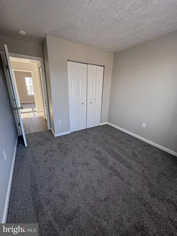 a view of an empty room and a window