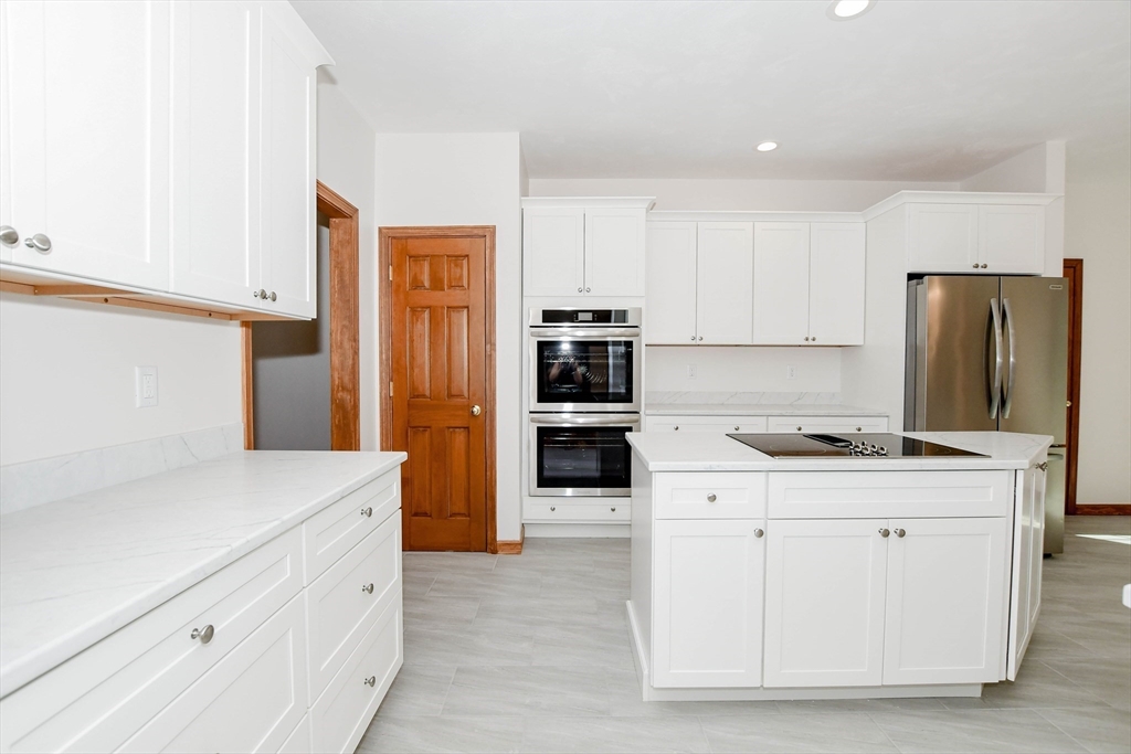 7 Upland Way Marion, MA 02738 - Photo 15 of 42 a kitchen with stainless steel appliances a refrigerator sink and cabinets