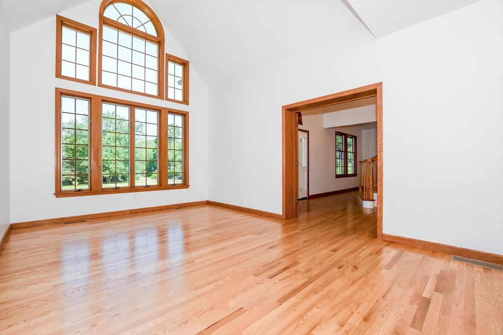 7 Upland Way Marion, MA 02738 - Photo 19 of 42 an empty room with wooden floor closet and windows