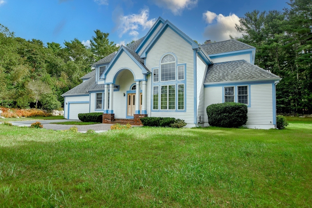 7 Upland Way Marion, MA 02738 - Photo 2 of 42 a front view of a house with a garden