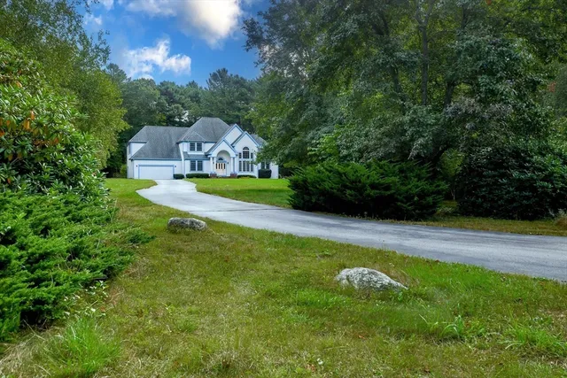 a aerial view of a house with swimming pool and garden