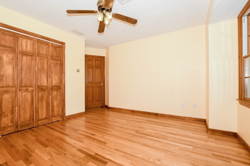 7 Upland Way Marion, MA 02738 - Photo 31 of 42 a view of empty room with wooden floor and fan