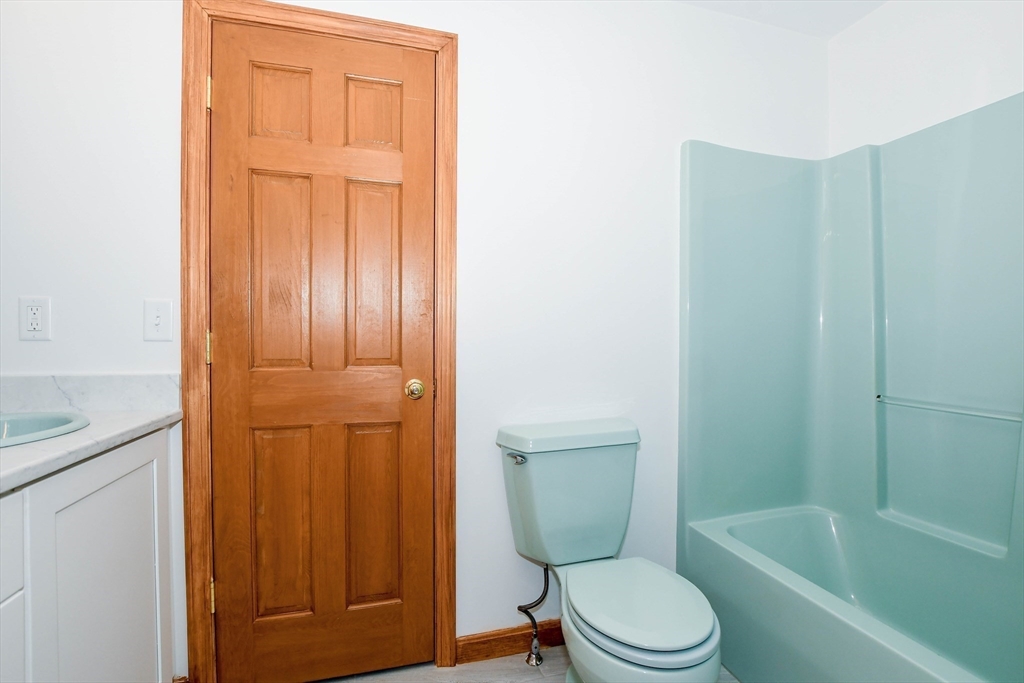 7 Upland Way Marion, MA 02738 - Photo 33 of 42 a white toilet sitting next to a bathroom sink