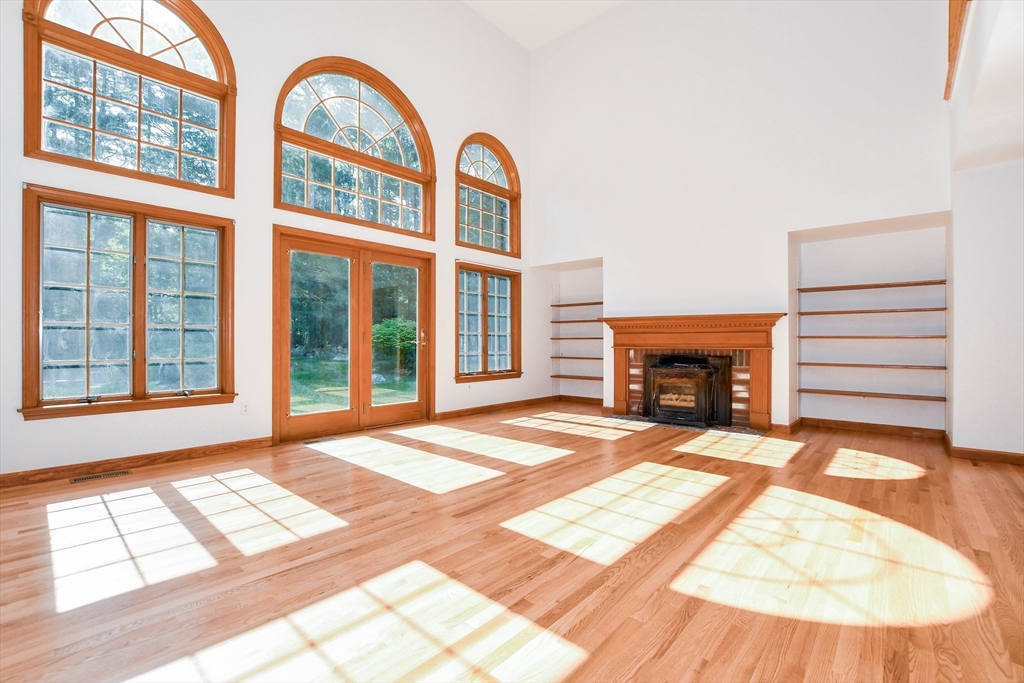 7 Upland Way Marion, MA 02738 - Photo 8 of 42 a view of an empty room with a window and a fireplace